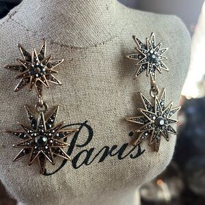 Jeweled star earrings pierced.